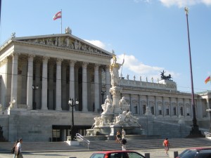The Austrian Parliament building. The big statue is Athena, Greek goddess of wisdom, and there are lots of other Greek gods decorating the building, adding to the classical architecture with all the steps and columns.  You really expect Aristotle to walk out.  