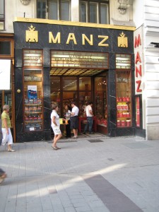The Manz bookstore â€“ the building is fairly decorated, but the bookstore front is modern (or was 100 years ago.)  