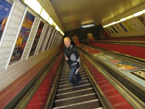 Graham (sans luggage) on the vertigo-inducing escalator to the Subway.  This line was built in the Communist era and doubles as a bomb shelter.  Now thatâ€™s efficient!