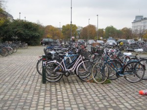There are bikes and bike parking lots everywhere.  Copenhagen may be the worlds most bike friendly city being compact, flat and with bike paths all over.  36% of residents commute to school or work by bike with a target of 50% by 2015.  The massive use of bikes keeps the congestion of automobiles on the roads to a minimum even during rush hour periods.