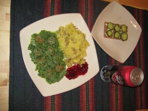 Meatballs with kale-cream sauce, potato mash and lingon berry sauce.  Also Jul Ã¶l, which is dark Christmas beer.