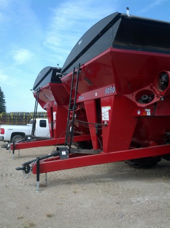 This is a grain trailer for unloading the combine.  You can bring this over to the grain bins or loading truck while the combine keeps going. 