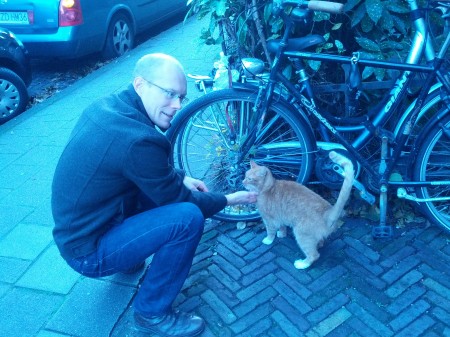 Graham petting the friendliest urban kitty of all time