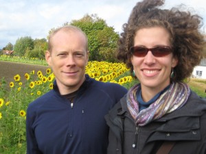 In front of a sunflower patch planted by a bunch of pre-schoolers.