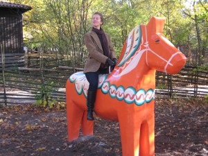 Catherine riding an iconic Dalarna horse.