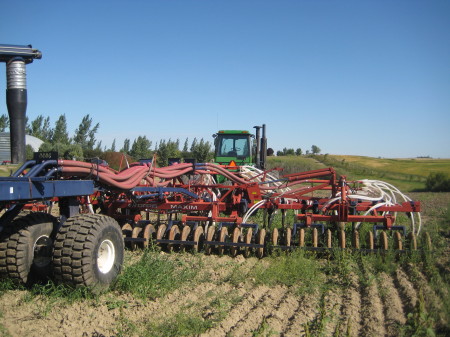 The air drill seeder behind the tractor - it is about 30 feet wide