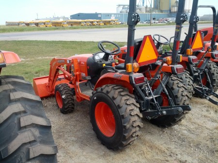 This mini loader is for small farm tasks, like plowing snow.  It is often driven by farm youth - sketch-o-matic!  This one has removable roll-over protection so it can be stored in a low shed - expect I bet once the ROP comes off it doesn't go back on.  :(