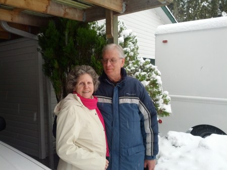 Mom and Dad out in the snowy yard