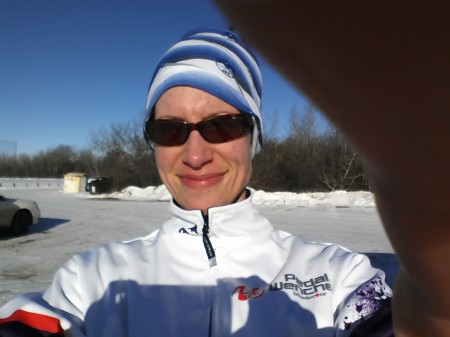 Me squinting into the sun after skiing.
