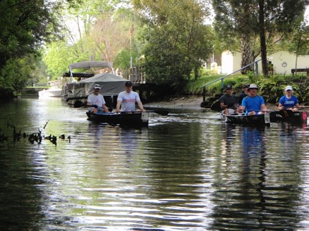 Paddling past the riverfront homes