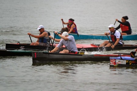 I am in the boat withe the green cover.  You can barely see me behind Graham.  Note that I am 1/2 a boat ahead (it did not last long). 