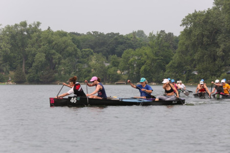 Me doing a crossbow draw to get around a bouy.  fiona behind me won the event, and Saska-buddy Edith is in the front of the other boat with Minnesota-Kate, who came second and third respectively